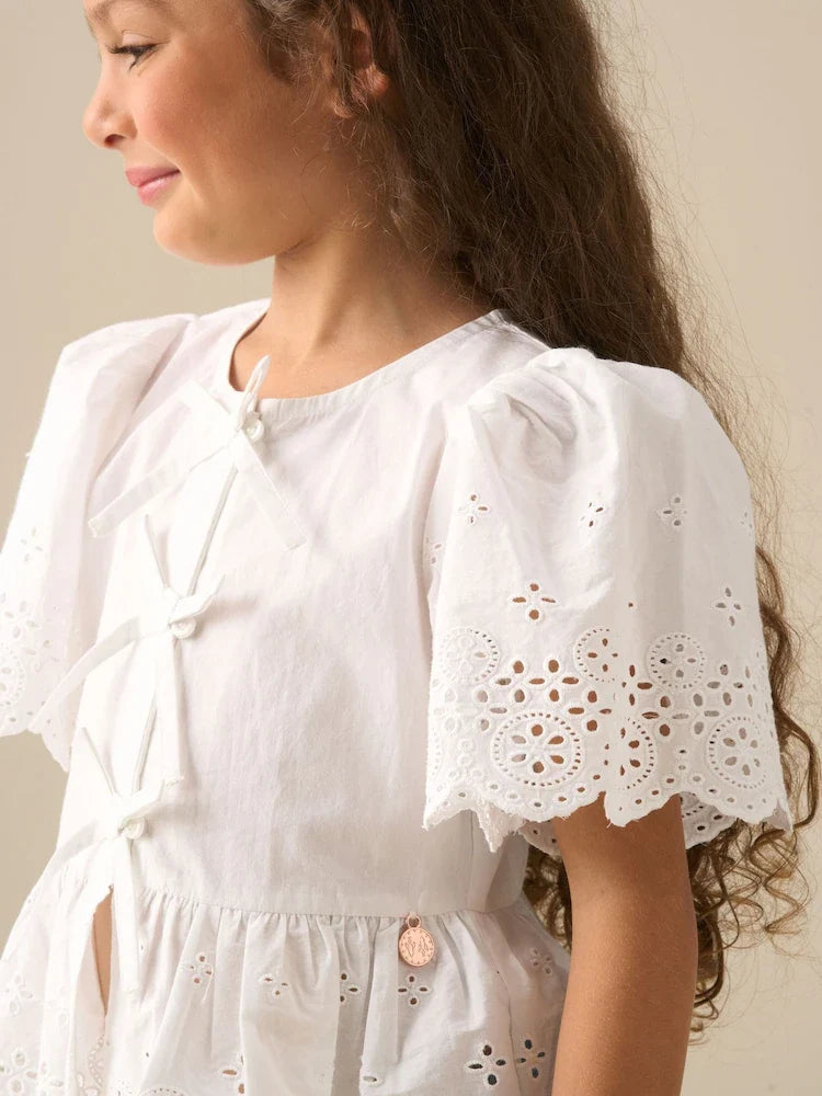 White - Angel & Rocket Ria blouse with eyelet embroidery, tie front and peplum