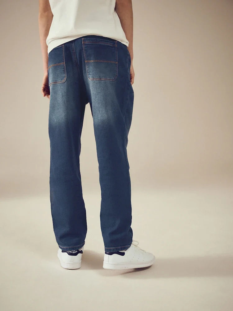 Indigo blue stretch jeans with elastic waistband (3-16 years)