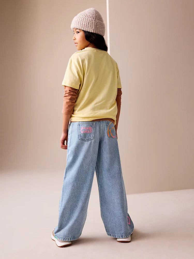 Medium blue - wide-leg jeans with SmileyWorld® print (3-16 years)